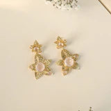 THE SHOW STEALER- ROSE QUARTZ FLOWER EARRINGSBe the star of the show, with these striking rose quartz pink gold earrings. A stunning statement piece that mixes well with any outfit.