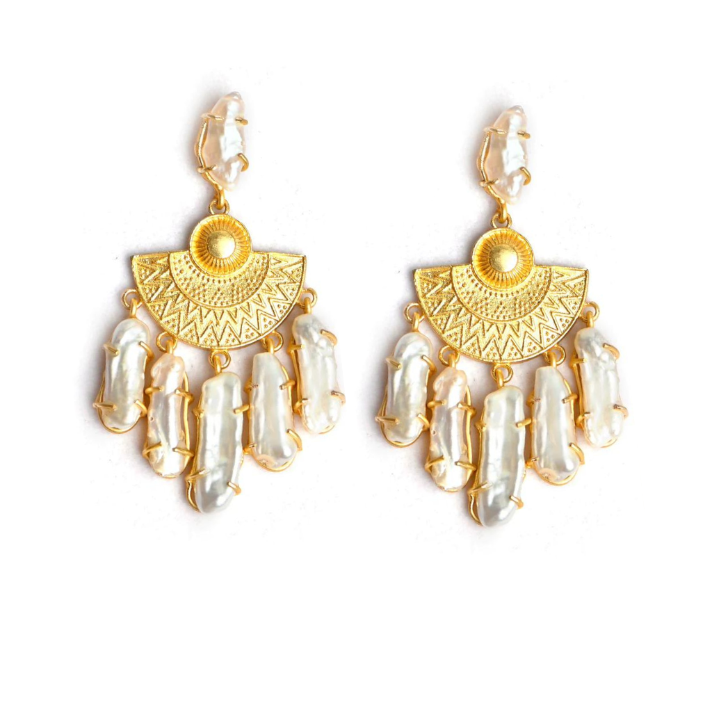 www.thejewelled.auThe Mother India earrings have been carved from a single piece of ivory. The pattern on the earrings are inspired by the beauty of the lotus flower. The Mother of India earrings features six precious freshwater pearls hanging from a backing made of antique gold platting.